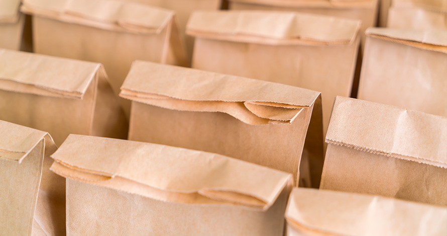 Rows of bagged lunches for students. 