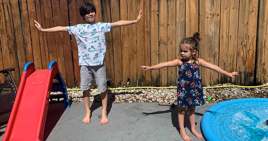 Kids demonstrate social distancing during a play date. 