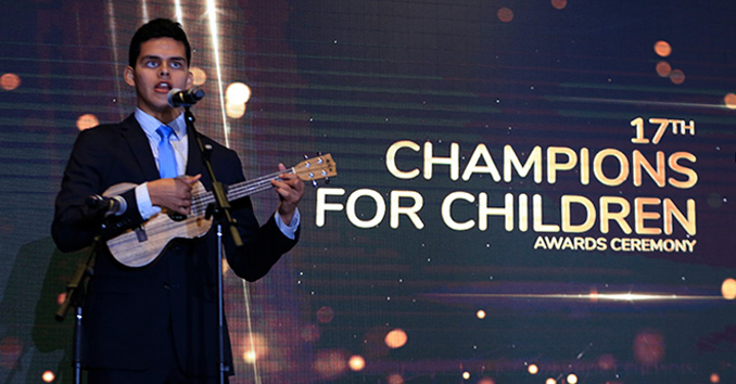 Singer Silvio Plata performing on stage at the 17th Champions for Children Awards